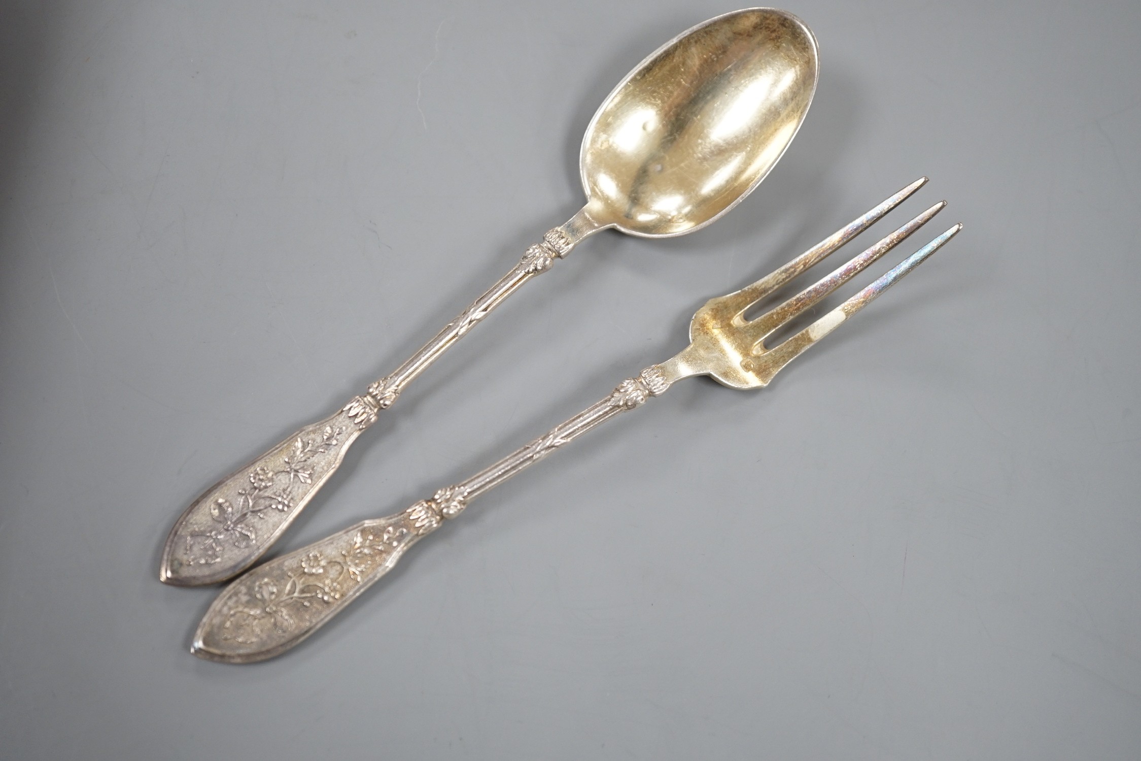 An early 20th century cased set of twelve French 950 standard white metal tea knives, spoons and forks, by Henin & Vivier and Henin & Cie?, retailed by Charles Pellegrin, spoon 14.1cm, 20oz.